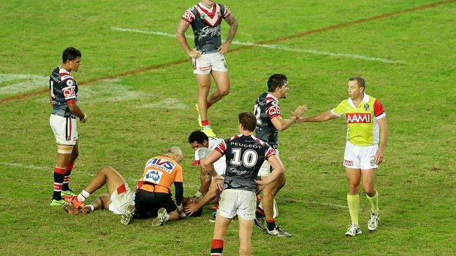 Referee Ben Cummins speaks to Roosters players during the round eight NRL match between the St George Illawarra Dragons and the Sydney Roosters at Allianz Stadium on April 25.