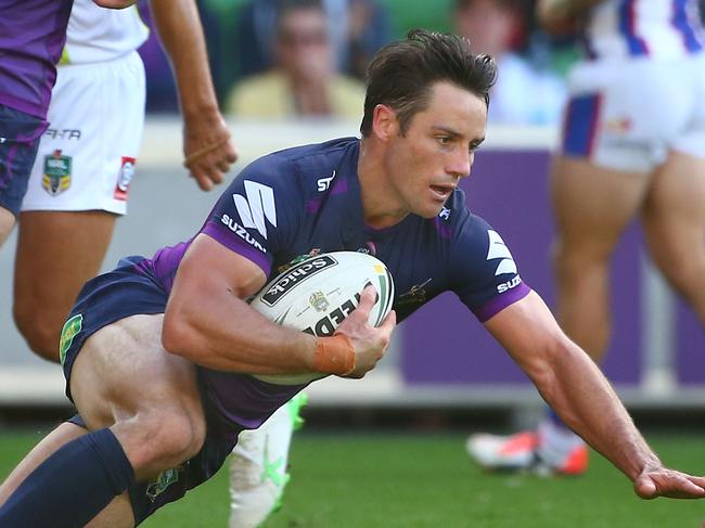 MELBOURNE, AUSTRALIA - APRIL 02: Cooper Cronk of the Storm scores a try during the round five NRL match between the Melbourne Storm and the Newcastle Knights at AAMI Park on April 2, 2016 in Melbourne, Australia. (Photo by Scott Barbour/Getty Images)