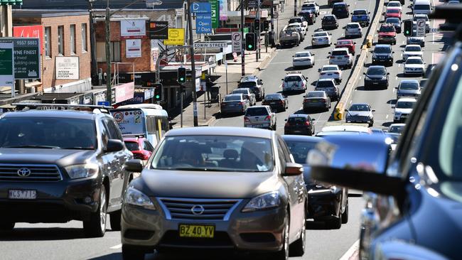 Heavy traffic travelling through the shopping precinct along Victoria Road at Drummoyne, Sydney. Picture: AAP