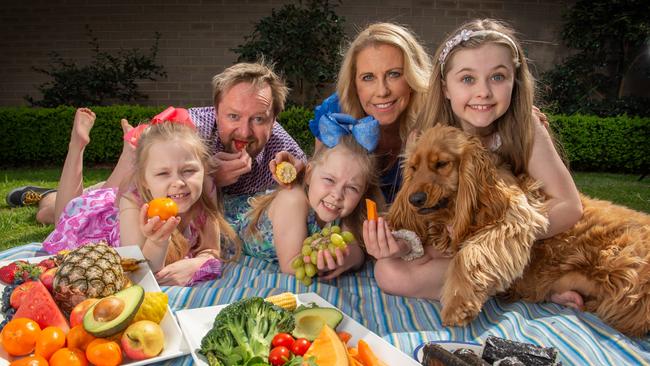 Fiona Annett and her husband Scott and their kids Jessie (Pink Bow), Tilly (Blue) and Sophie (Sparkly Headband). Picture: Tony Gough.