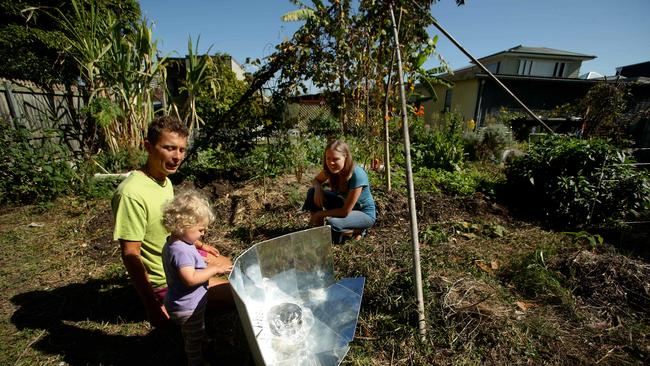 Roman Spur with his partner Jana and daughter Lada at their sustainable home which will be open to the public this weekend to show people just what a sustainable approach to living can look like. A solar oven Roman bulit for cooking things like cakes. Pic Mark Calleja