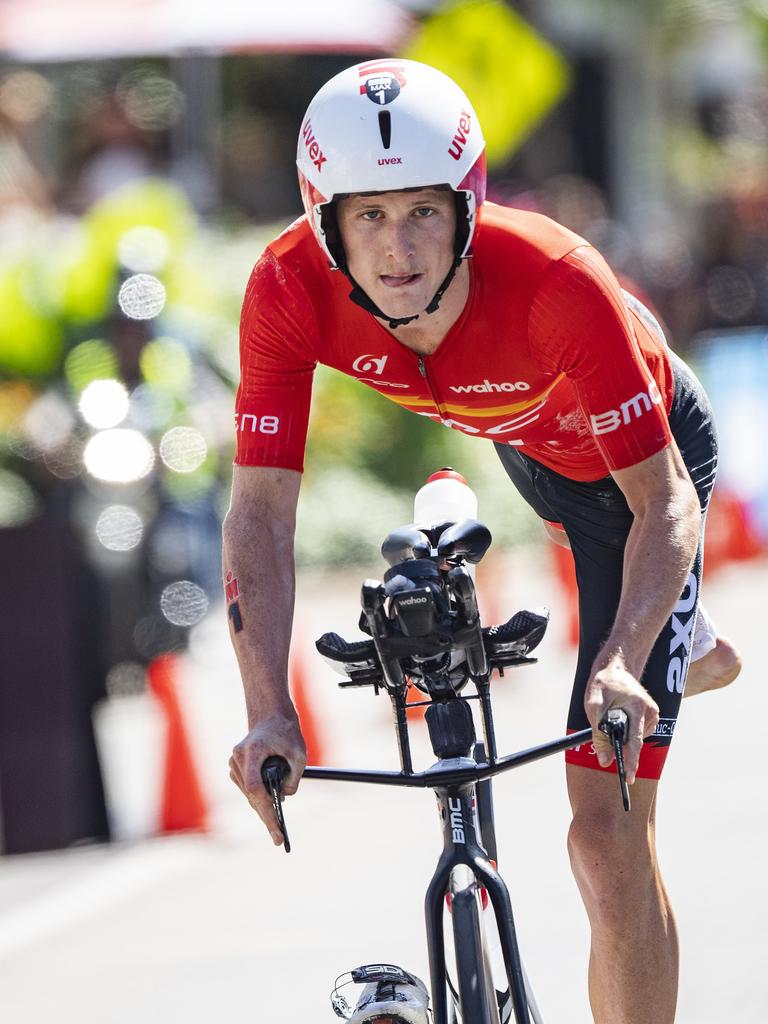 Cairns Iron Man - former champ Max Neumann de-bikes as he completes the bike leg in 3rd place. Picture: Brian Cassey