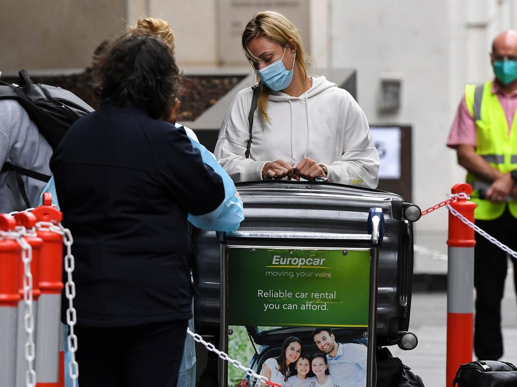 Tennis players, coaches and officials arrive at a hotel in Melbourne on January 15, 2021, before quarantining for two weeks ahead of the Australian Open tennis tournament. Picture: William West/AFP