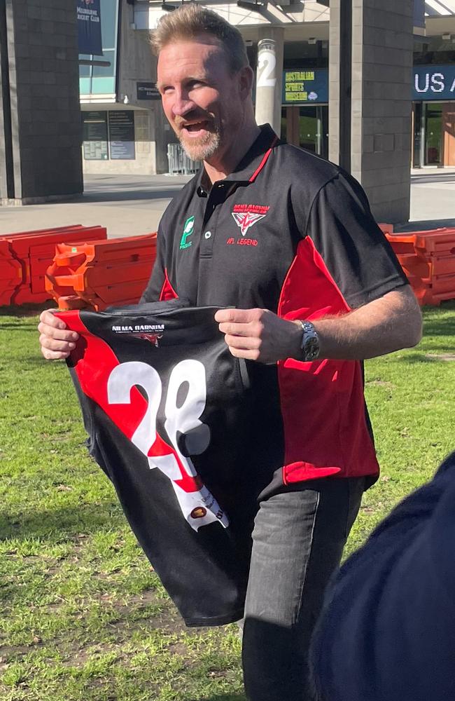 Nathan Buckley is all smiles as he receives his red and black Nilma Darnum jersey ahead of this weekend. Picture: Shane Jones.