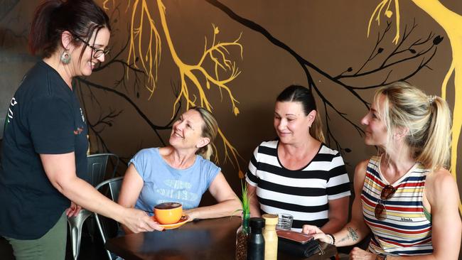 (L-R) Butternut Cafe’s Lisa Cruickshank serves Shelley Jowett, Lisa Tagg and Leanne Jowett. (AAP IMAGE / Angelo Velardo)