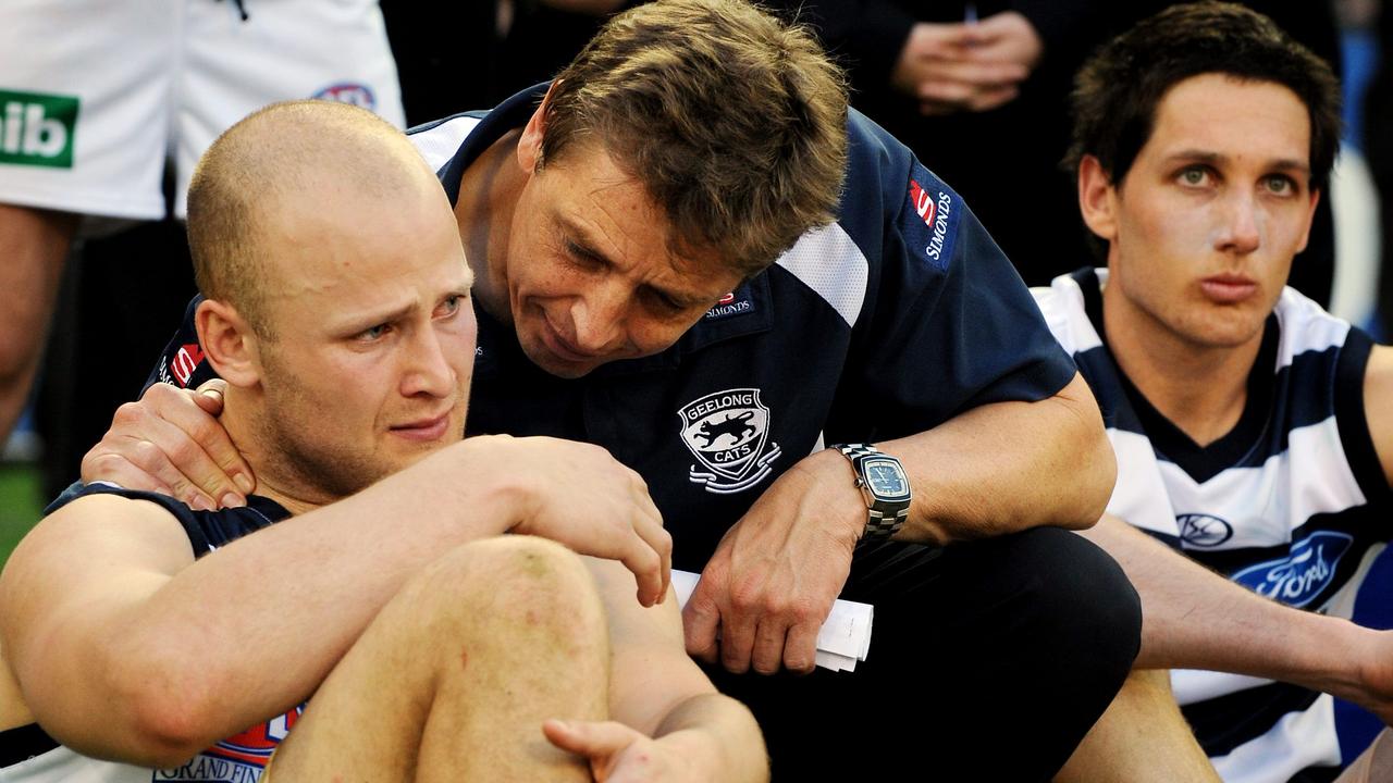 NOT FOR INTERNET... 27/09/2008 SPORT: 2008 AFL Grand Final - Geelong v Hawthorn at MCG. Coach Mark Thompson console's a teary Gary Ablett