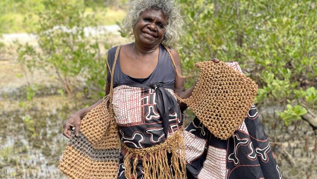 Esther Yarllarlla, Babbarra Women’s Centre, with her woven dili bags and pubic covering. Picture: Jessica Stalenberg