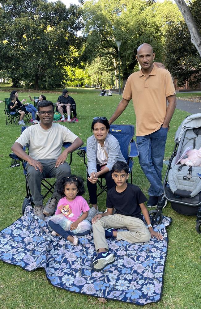 Nuwan Samarasiri and family at Treasury Gardens in the Melbourne CBD for the 2024 New Year's Eve fireworks. Picture: Gemma Scerri