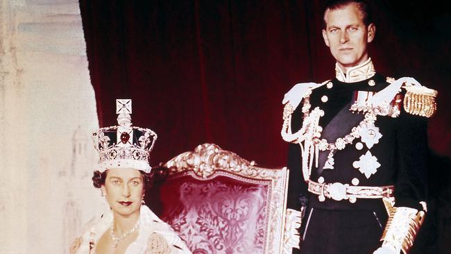 Picture taken on June 2, 1953 shows Britain's Queen Elizabeth II (L) posing with her husband Prince Philip on the Queen's Coronation day at Buckingham Palace, in London. Picture: AFP