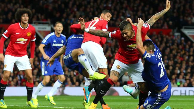 MANCHESTER, ENGLAND - OCTOBER 26: John Terry of Chelsea tangles in the penalty area with Marcos Rojo of Manchester United during the Barclays Premier League match between Manchester United and Chelsea at Old Trafford on October 26, 2014 in Manchester, England. (Photo by Alex Livesey/Getty Images)