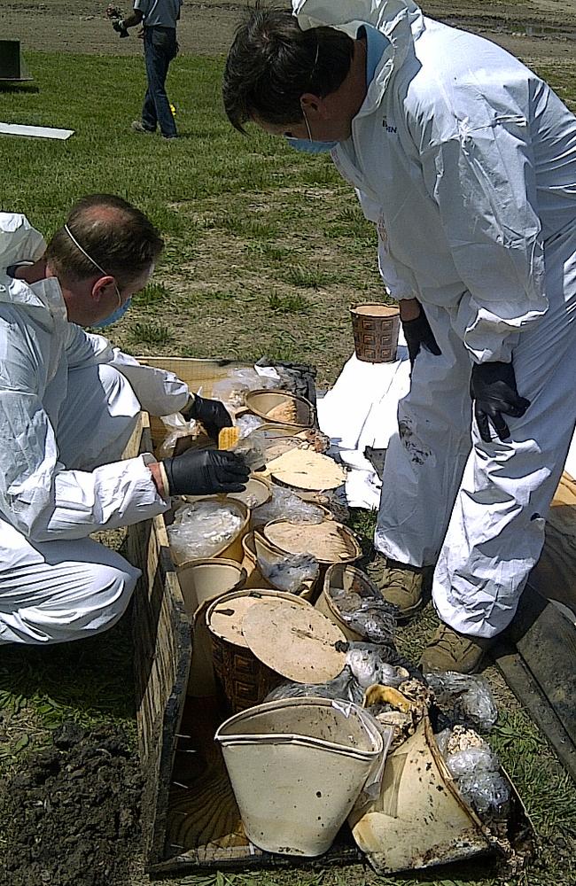 Buckets containing jaw bones and teeth of Gacy’s victims. Remains were exhumed in the hope of identifying eight unidentified victims through forensic testing. Picture: AP