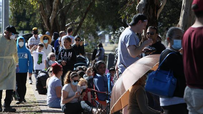 Huge lines of people at the Parafield Airport testing tent, as thousands of Adelaide residents turn out for testing. Picture: Emma Brasier