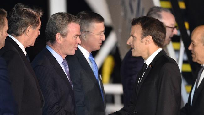 Australian Minister for Defence Industry Christopher Pyne greets Mr Macron. Picture: Peter Parks