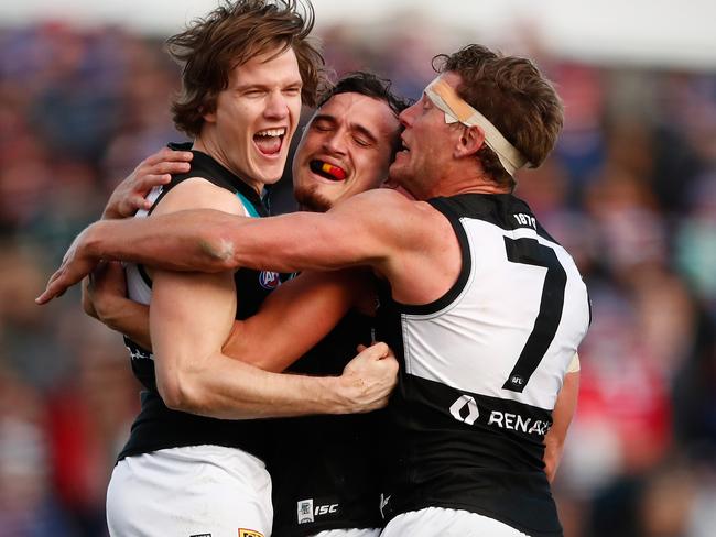 Port Adelaide players celebrate a vital goal. Picture: Getty Images