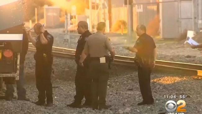 Tragedy ... Police examine the scene where Greg Plitt was struck and killed by a train. Picture: CBSLA
