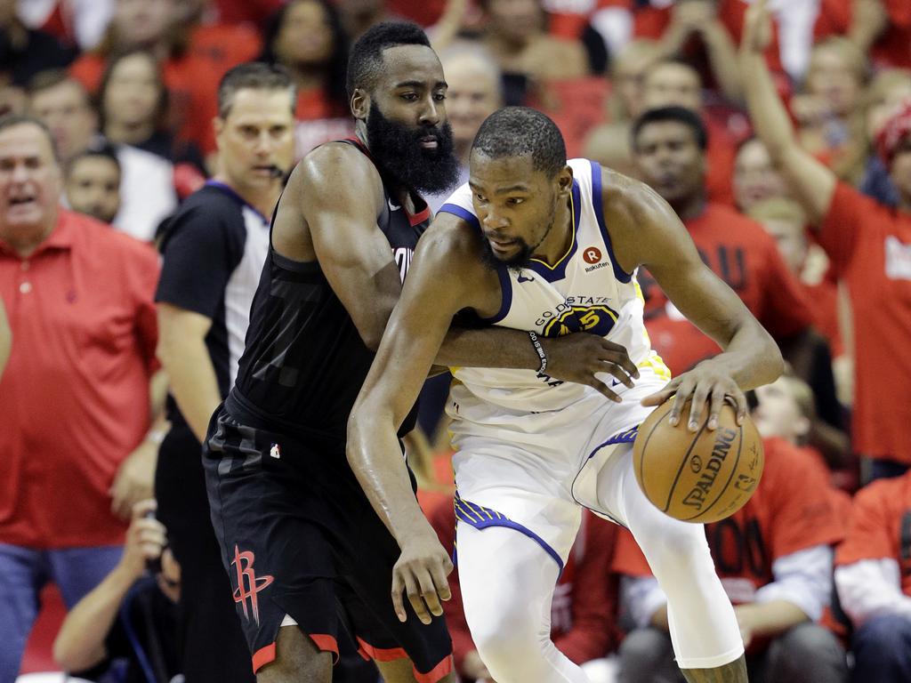 Kevin Durant goes to work against James Harden. (AP Photo/David J. Phillip)