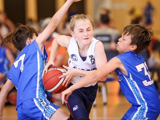 SPORT ADVSA Junior Country Basketball Championships from St Clair Recreation centre, WoodvilleGreat SouthernÃ¢â¬â¢s  Riley Clifford breaks through Eastern Hills Lenny Wheatley & Levi Lloyd.  IMAGE/Russell Millard