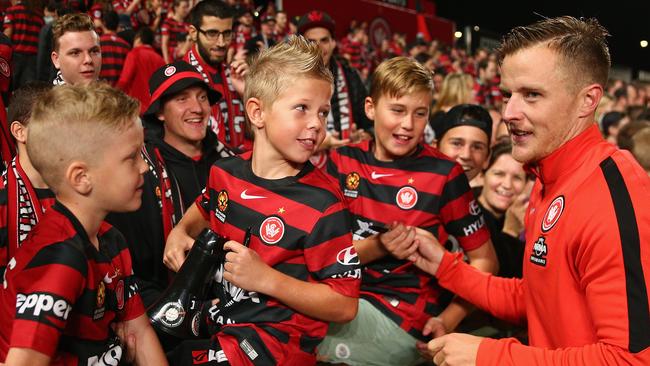 Scott Jamieson of the Wanderers signs autographs for fans after winning the A-League Semi Final match. (Photo by Cameron Spencer/Getty Images