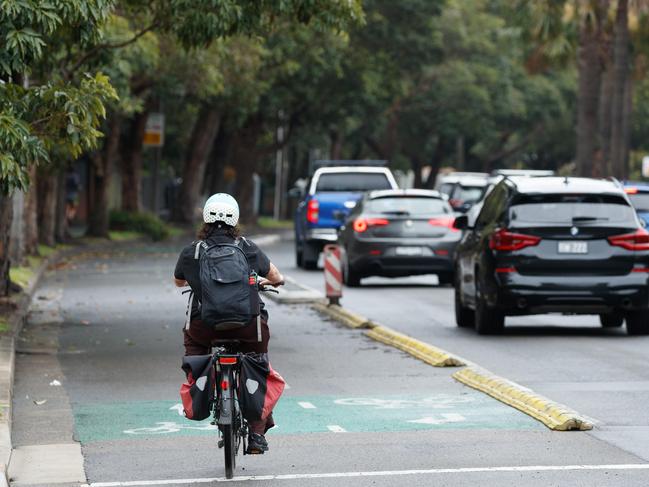 A cyclist rides down the bike lane on Moore Park Rd, Paddington. Picture: Max Mason-Hubers