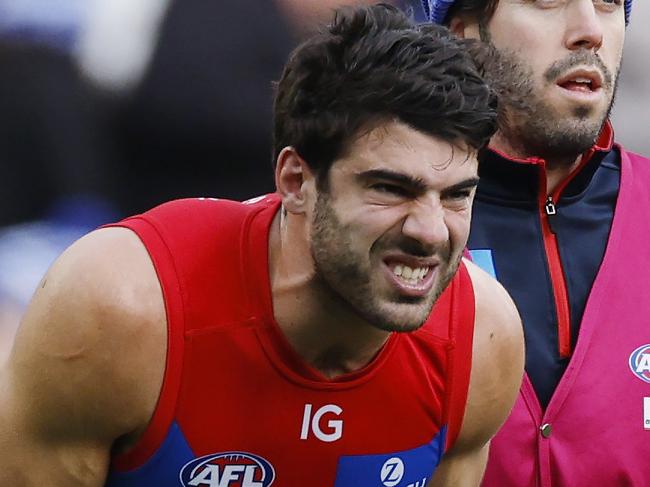 MELBOURNE, AUSTRALIAÃ June 10, 2024.  AFL Round 13. Big Freeze at the G. Collingwood vs Melbourne  at the MCG.   Christian Petracca of the Demons in pain after copping a Darcy Moore knee in the ribs late in the 1st qtr.       . Pic: Michael Klein