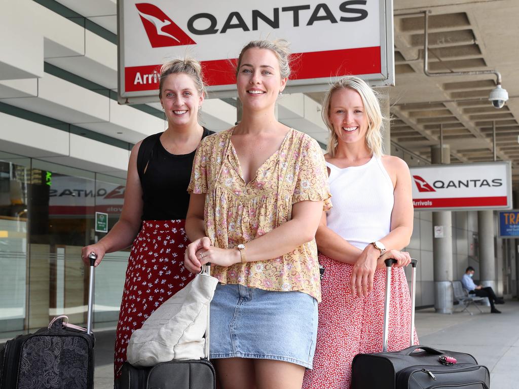 Louisa Caswell, 31, Lauren Douglas, 32, and Emma Walsh, 30, all from Tasmania, at Brisbane Airport on their way to Airlie Beach. Picture: Liam Kidston