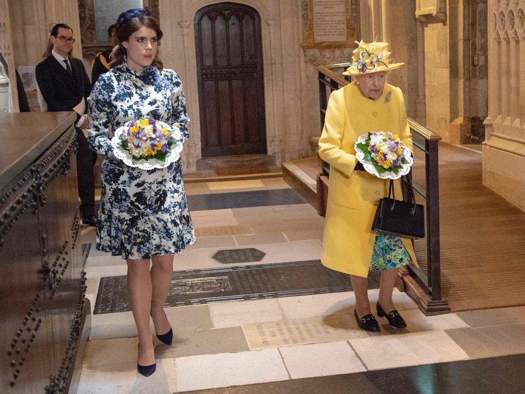 Britain's Queen Elizabeth II arrives with Britain's Princess Eugenie of York to take part in the Royal Maundy Service at St George's Chapel in Windsor. Picture: AFP, Arthur Edwards