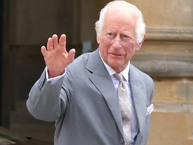 SOUTHPORT, ENGLAND - AUGUST 20: King Charles III waves to wellwishers as he arrives outside Southport Town Hall during his visit to meet local community and emergency services on August 20, 2024 in Southport, England. His Majesty met with those affected by the 29th July attack and riots alongside thanking frontline emergency staff for their ongoing work. (Photo by Jan Kruger/Getty Images)