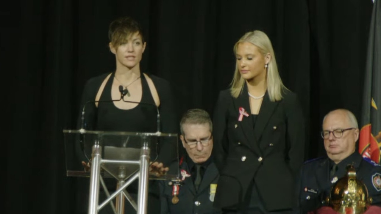 Izzy's partner Bec speaking at the memorial service