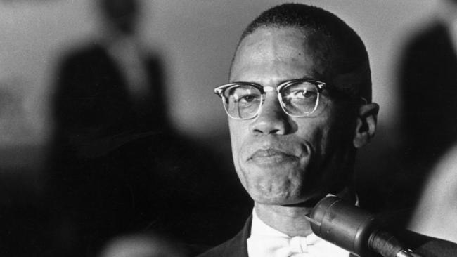 FILE - FEBRUARY 17, 2015: February 21st sees the anniversary of 50 Years Since The Assassination Of Malcolm X circa 1962: American political activist and radical civil rights leader, Malcolm X (1925 - 1965) standing at a podium during a rally of African-American Muslims held in a Washington, DC arena. He is wearing a formal jacket and a white bow-tie. (Photo by Richard Saunders/Hulton Archive/Getty Images)