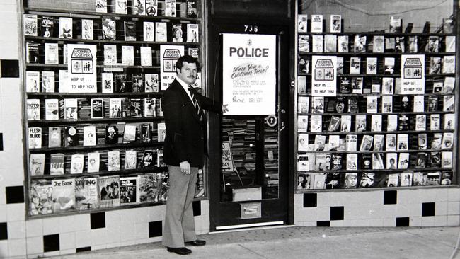 A Homicide Squad detective outside the Thornbury bookshop where Ms James was murdered.