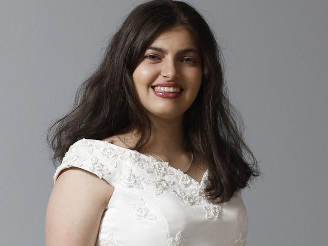 Kristy Fava models a wedding dress that is on sale for $200 from the St Vincent de Paul society's opportunity shop at the Showgrounds Shopping Centre, Mulgrave Road, Bungalow. Picture: Brendan Radke