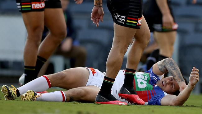 Mitchell Pearce of the Knights lies injured.