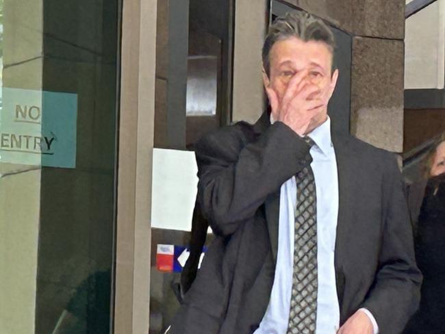 Chiropractor Ian Deitch, left, leaves Melbourne Magistrates' Court with his lawyer Simon Kenny, right, during a break in proceedings.