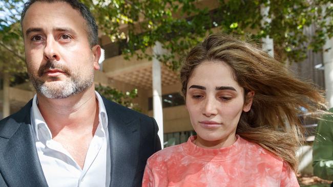 Property and Construction lawyer Ashlyn Nassif, 27, daughter of Mr Nassif, leaves Surry Hills Police on bail with her lawyer. Picture: David Swift