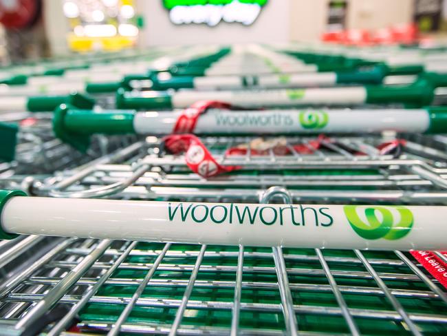 The logo of Woolworths Ltd.'s Woolworths chain of supermarkets is displayed on shopping trolleys in Sydney, Australia, on Tuesday, Aug. 27, 2013. Woolworths Ltd., Australia's largest retailer, is scheduled to report full-year results on Aug. 28. Photographer: Ian Waldie/Bloomberg