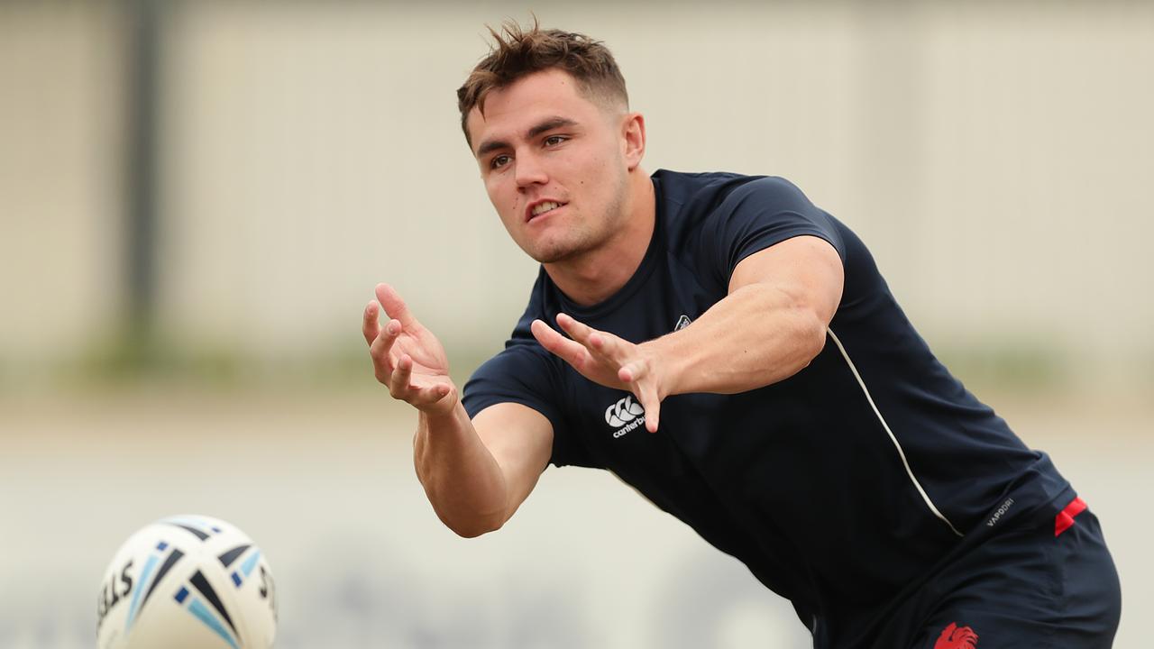 Kyle Flanagan of the Sydney Roosters passes during a training session