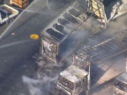 Multiple trucks destroyed in Yatala fire (source 9 News)