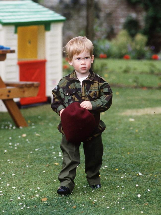 Early interest ... A young Harry plays at the family home, Highgrove, dressed in a Parachute Regiment uniform. (Photo by Tim Graham/Getty Images)