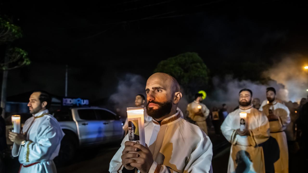 Led by more than 70 pallbearers carrying the coffin of St Charbel, the procession was accompanied by hymns of faith, as it made its way through the streets of Punchbowl. Picture: Giovanni Portelli Photography