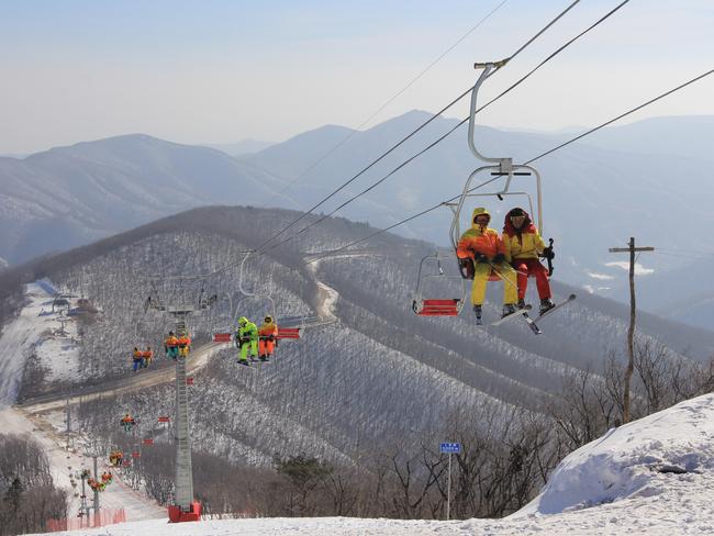 North Korean students ride a chair lift at the Masik ski resort in 2014 near Wonsan in northeastern North Korea. Picture: Jean H. Lee/Getty Images
