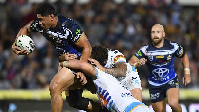 Jason Taumalolo breaks through the Titans defence. Picture: Ian Hitchcock/Getty Images