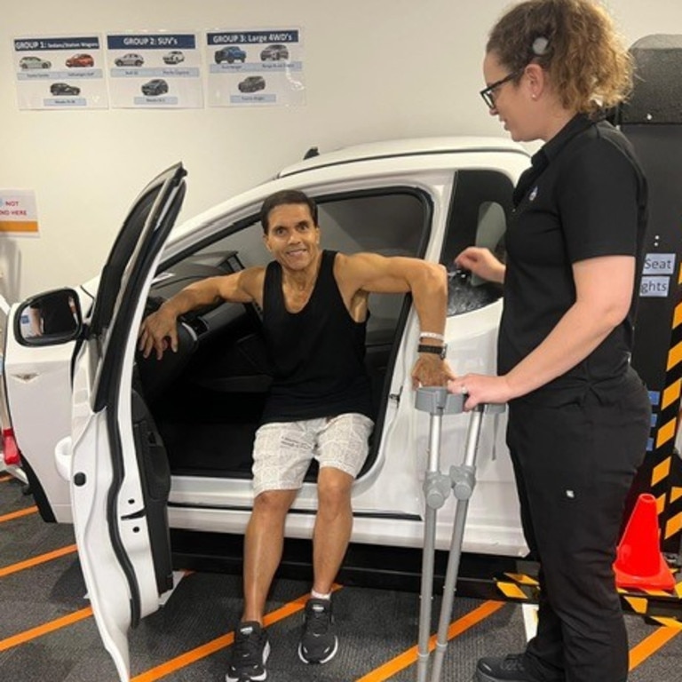 Joint surgery patient Terry Martinesz, practises, watch by occupational therapist Matilda Freeman, on the 