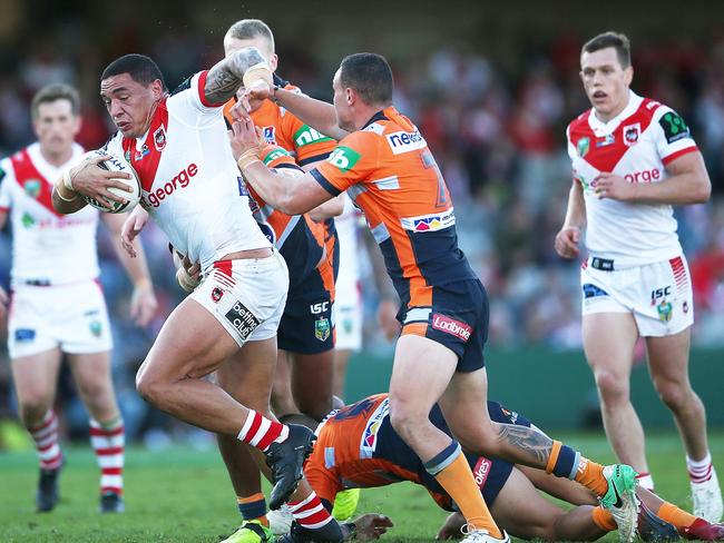 Tyson Frizell of the Dragons is met by the Newcastle defence.