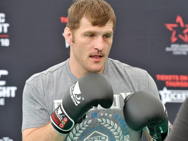 Stipe Miocic hitting pads with a trainer. Photo: Roger Wyman.