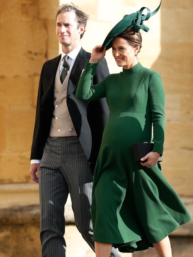 A heavily pregnant Pippa Middleton and her husband James Matthews arrive. Picture: AFP