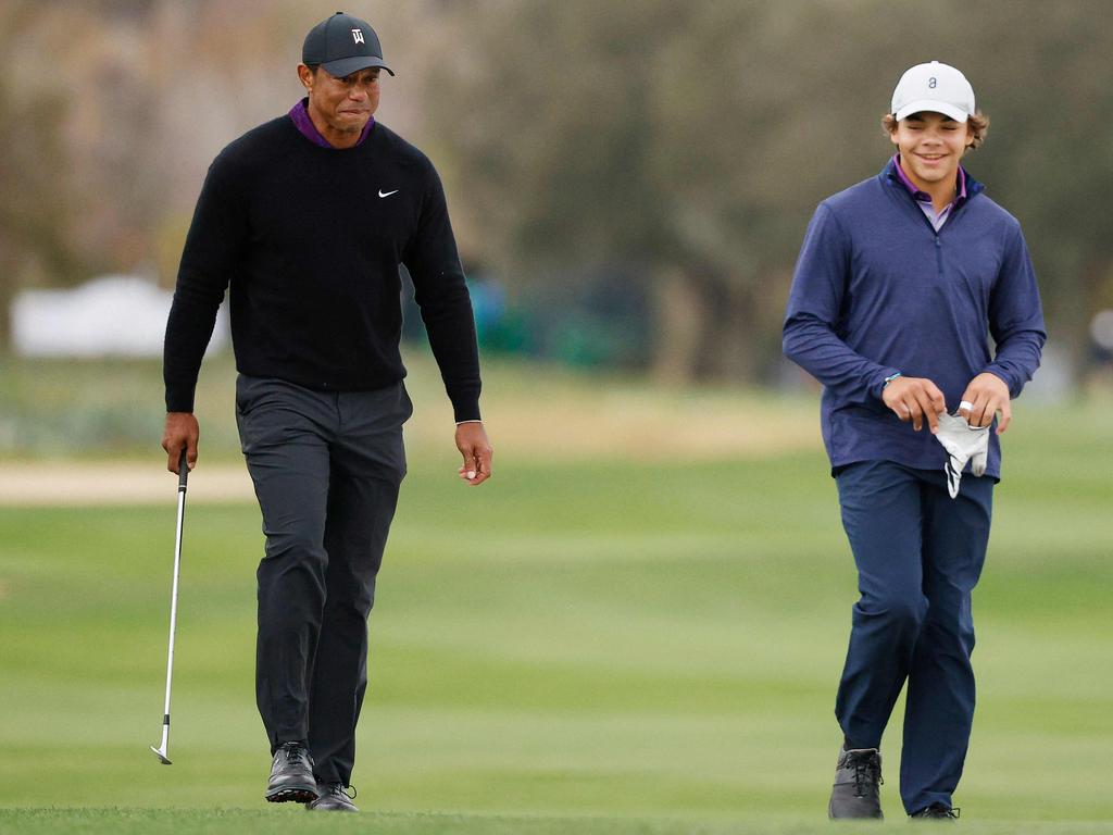 Tiger Woods of the United States and his son Charlie Woods walk on the 18th green during the pro-am prior to the PNC Championship at The Ritz-Carlton Golf Club on December 15, 2023 in Orlando, Florida. Mike Mulholland/Getty Images/AFP (Photo by Mike Mulholland / GETTY IMAGES NORTH AMERICA / Getty Images via AFP)