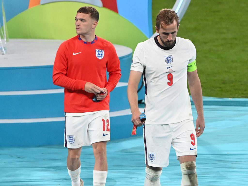 Harry Kane and Kieran Trippier of England look dejected after removing their medals.