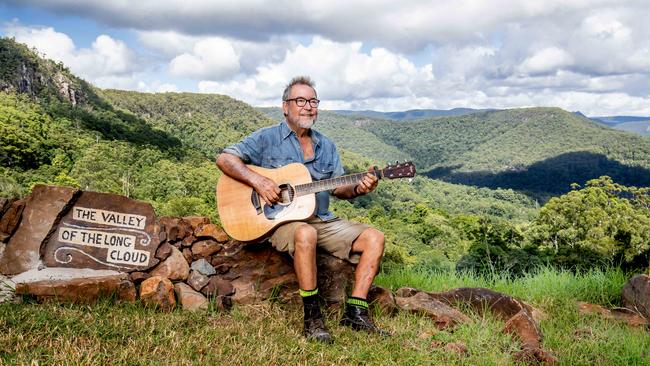 John Williamson plays Cootamundra Wattle at his home near Springbrook, Queensland for Review’s Isolation Room – a video series starring top musicians and artistic performers recorded at their homes. Image cropped from photograph by Luke Marsden for The Australian.