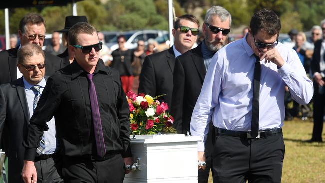 Pallbearers caring the coffin of nurse Gayle Woodford at her funeral in Stansbury. Photo Tom Huntley