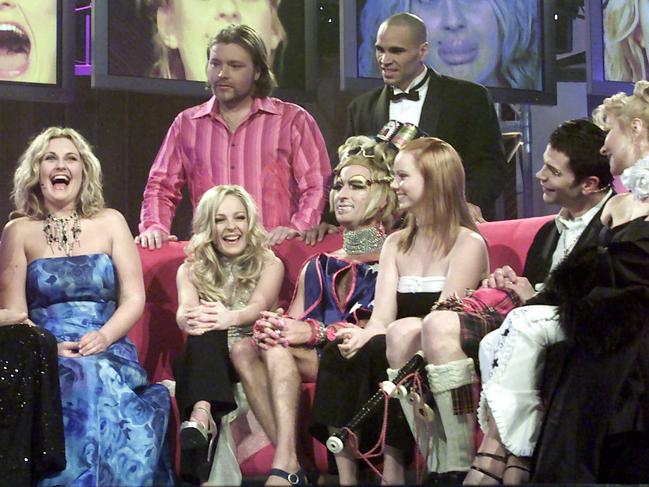 Contestants (from left) Sara-Marie Fedele, Imogen Bailey, Kyle Sandilands (back row), Vanessa Wagner, Anthony Mundine (back row right), Kimberley Cooper, Dylan Lewis, Adriana Xenides, on the Celebrity Big Brother set 2002.